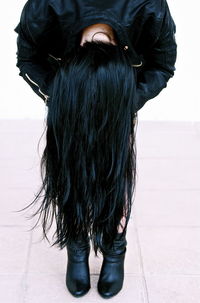 Close-up of woman standing by railing