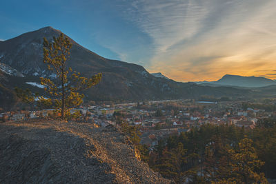 A panoramic wide landscape view of veynes, an old town in the french alps, during the sunset