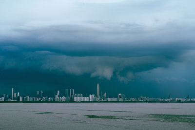 City by sea against sky