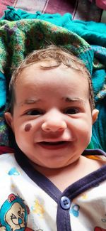 Close-up portrait of a smiling boy