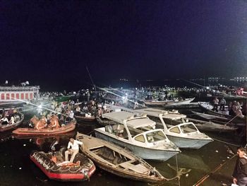 Boats in harbor at night