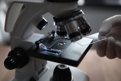 Close-up of hand holding camera