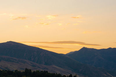 Scenic view of mountains against sky during sunset