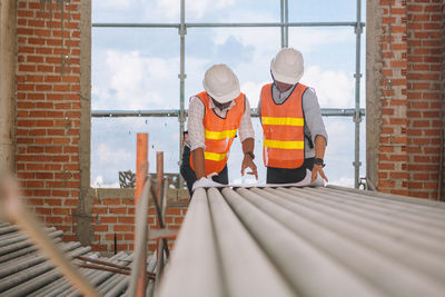 Rear view of men working