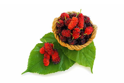 Close-up of strawberry over white background