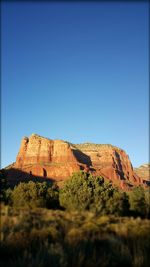 Low angle view of built structure against clear blue sky