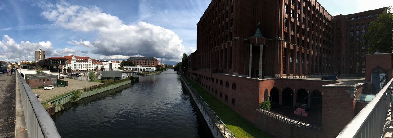 PANORAMIC VIEW OF CANAL AGAINST SKY IN CITY
