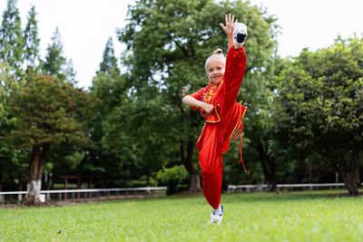 Low angle view of woman standing on field