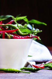 Close-up of chili peppers on table