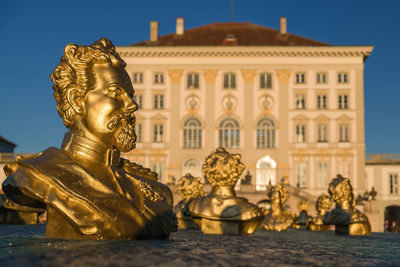 Statue of historic building against sky