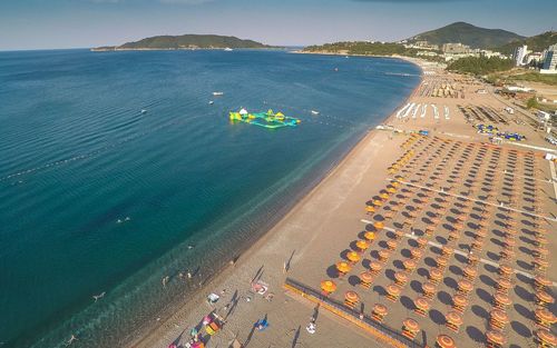 High angle view of beach by sea against sky