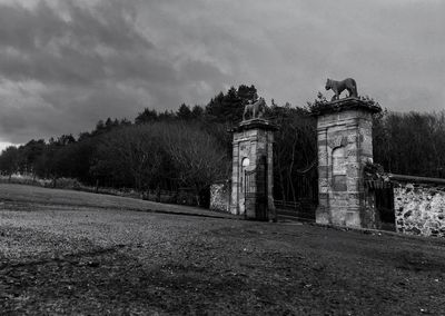 Built structure against cloudy sky