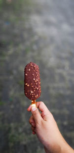 Close-up of hand holding ice cream