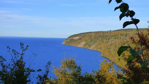 Scenic view of sea against blue sky