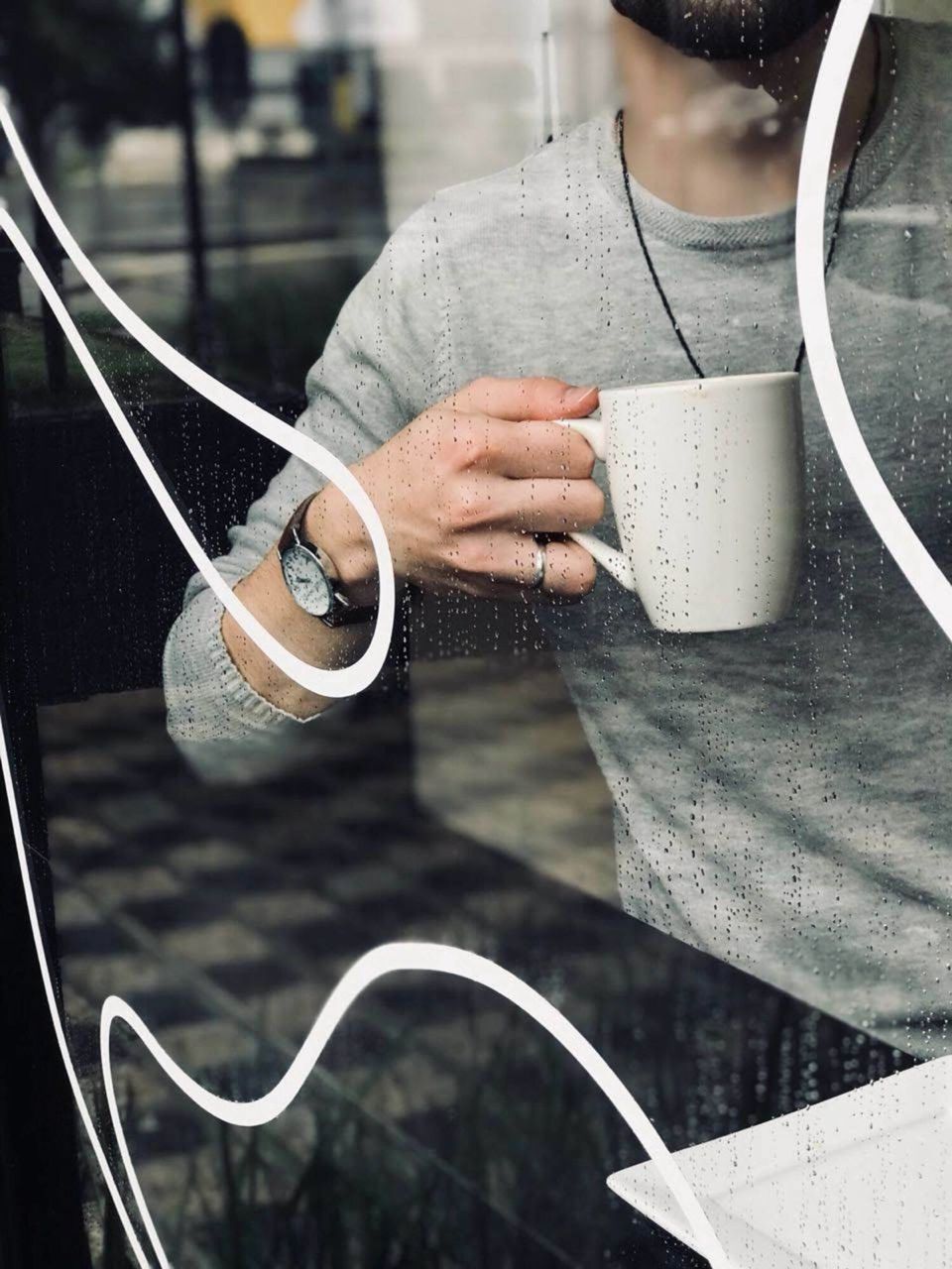 WOMAN HOLDING COFFEE CUP