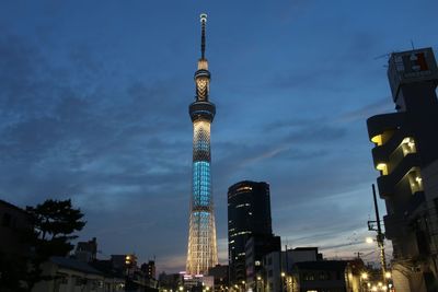 Low angle view of communications tower against sky