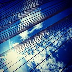 Low angle view of modern building against blue sky