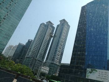 Low angle view of skyscrapers against sky