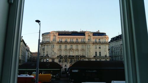 Low angle view of buildings against clear sky