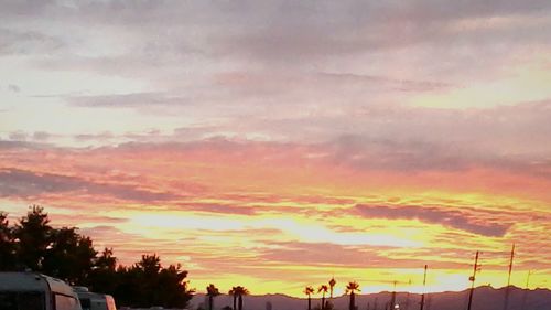 Scenic view of dramatic sky at sunset