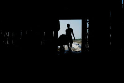 Silhouette man standing in building