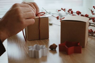 Close-up of hands holding table