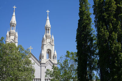 Low angle view of church against blue sky