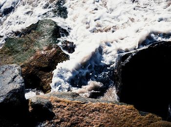 Scenic view of rock formation in sea during winter