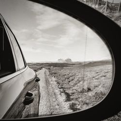 Reflection of sky on side-view mirror