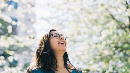 Portrait of young woman looking away outdoors