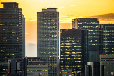 Illuminated buildings in city at night