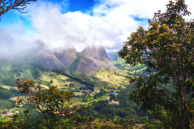 Scenic view of tree mountains against sky