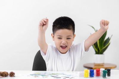 Portrait of boy on table