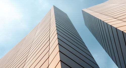 Low angle view of modern buildings against sky