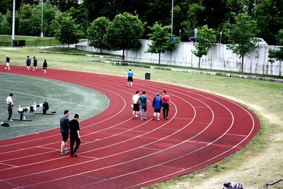 People walking on running track