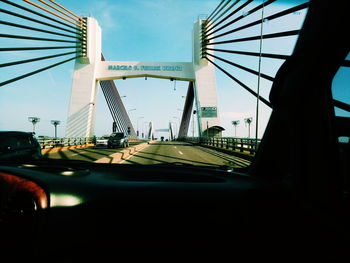 Close-up of bridge against sky in city