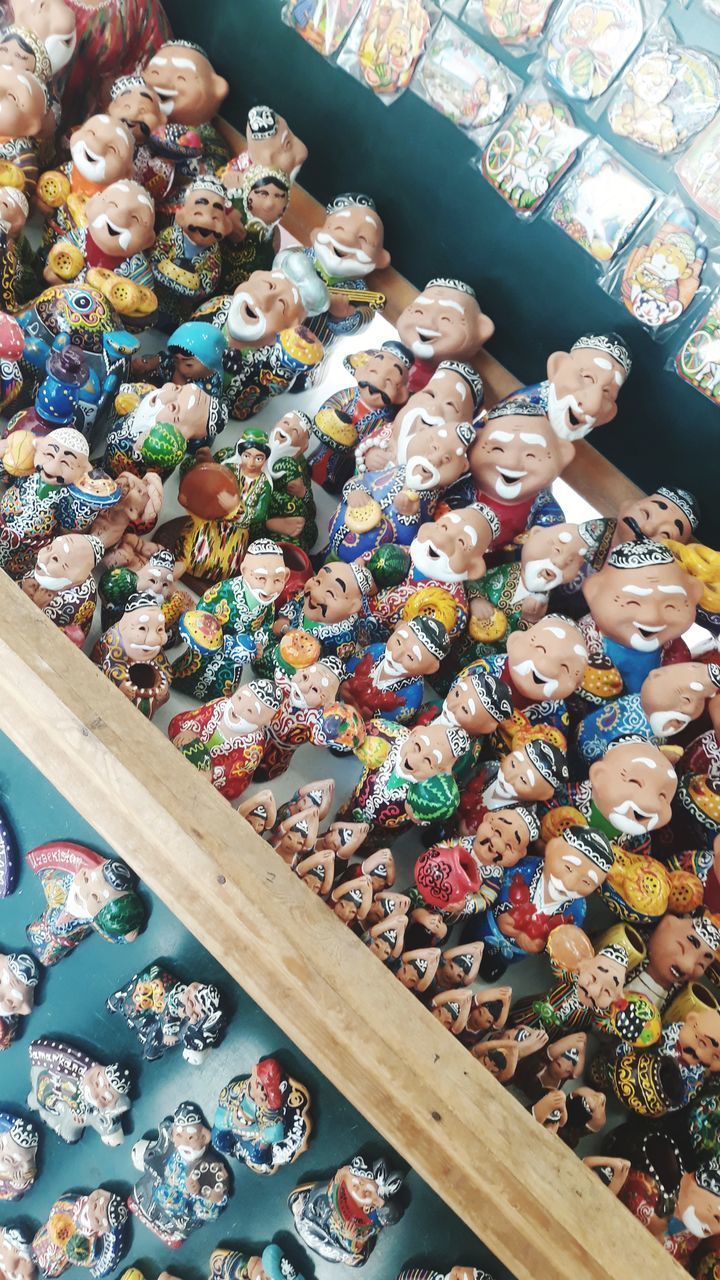 HIGH ANGLE VIEW OF TOYS FOR SALE IN MARKET