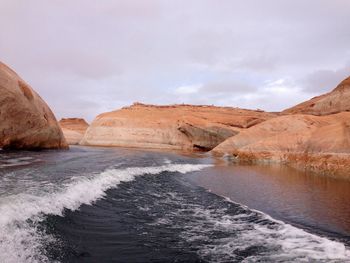 Scenic view of shore against sky