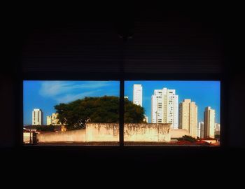 Modern buildings against sky in city