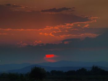 Scenic view of dramatic sky during sunset