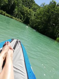 Low section of man on boat in water