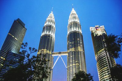 Low angle view of modern buildings against sky