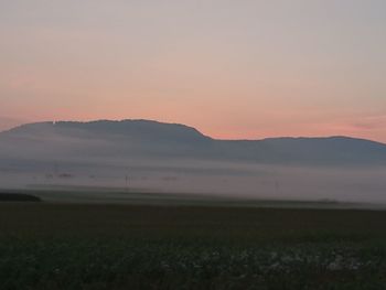 Scenic view of landscape at sunset