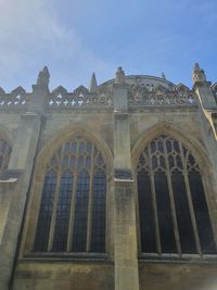 Low angle view of old building against blue sky