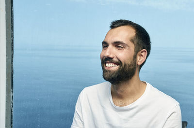 Portrait of a smiling man in water