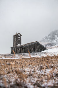 Old church on land during winter