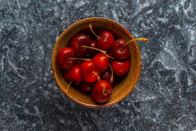 High angle view of cherries in bowl on table