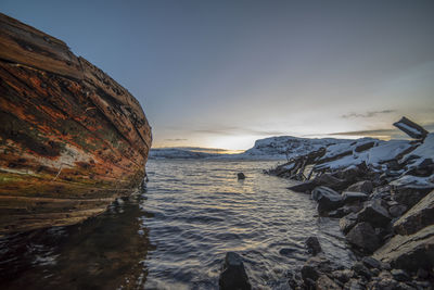 Cemetery old ships teriberka russia, wooden remains of industrial fishing boats at sea.