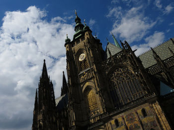 Low angle view of cathedral against cloudy sky