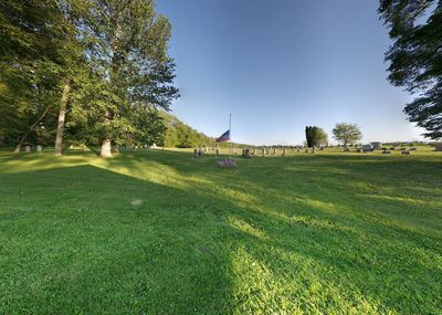 View of golf course on field against sky